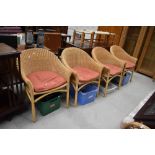 A set of four modern canework tub chairs