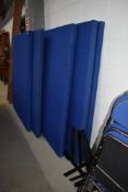 A selection of modern blue room dividers, with metal T stands