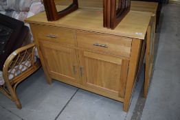 A modern side cabinet, double drawers over cupboard, approx. W97 D47 H78cm