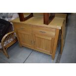 A modern side cabinet, double drawers over cupboard, approx. W97 D47 H78cm