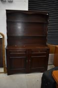 A reproduction oak effect dresser, width approx. 122cm