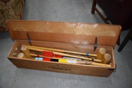 A traditional Croquet set, in typical crate, some pieces marked Jaques