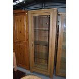 A modern golden oak glazed display cabinet, approx. W69cm D44cm H179cm