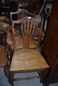 Two 19th Century oak slat back solid seat chairs