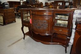 A Victorian mahogany chiffoneir base having demi bow front with carved applique panel, flanked by