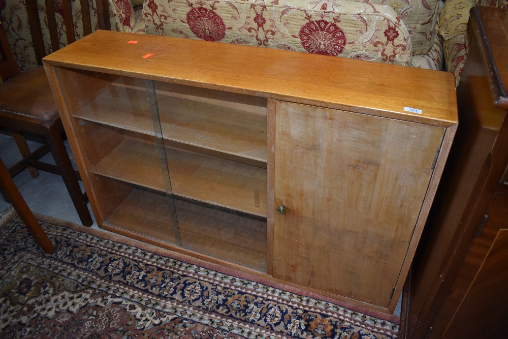 A vintage Lebus low bookcase havig sliding glass doors and cupboard section, approx dimensions