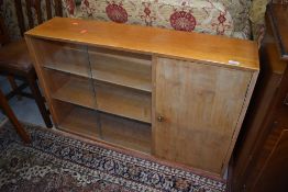 A vintage Lebus low bookcase havig sliding glass doors and cupboard section, approx dimensions