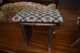 A traditional footstool with wood frame and moquette upholstery, approx 31 x 24cm