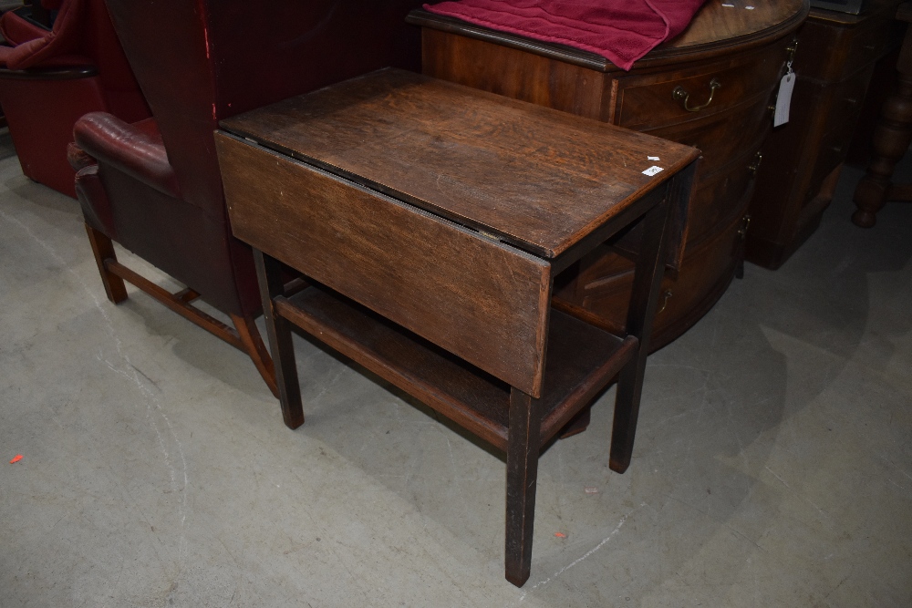 An early to mid 20th Century oak drop flap tea trolley (no castors)