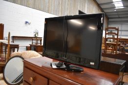 A Medion 32' TV, with remote