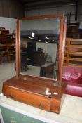 An early 20th Century toilet mirror on shaped drawer base, approx width 49cm