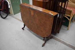 A Victorian walnut Sutherland table on turned and carved frame , shaped legs, scroll feet and pot