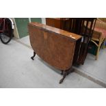 A Victorian walnut Sutherland table on turned and carved frame , shaped legs, scroll feet and pot