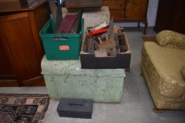 A vintage tin trunk and various vintage tools