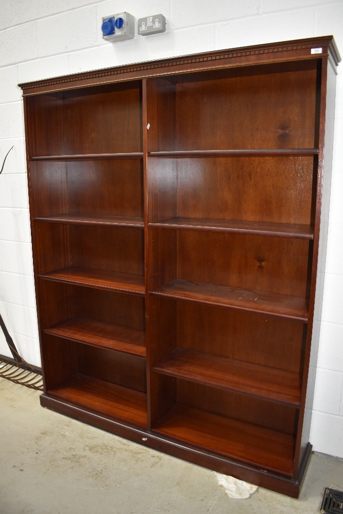 A double breasted shelving unit in a mahogany effect veneer 150cm wide