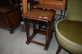 A vintage oak part nest of two tables