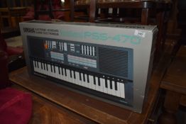 A Yamaha Portasound PSS-470 short scale keyboard, boxed