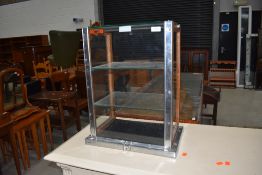 A vintage counter top display , labelled pyramid, oak frame with glass panels and shelves and