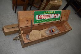 A vintage Croquet box (limited contents) and a projector screen