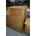 A modern golden oak narrow chest of five drawers, dimensions approx. W58cm D42cm H103cm