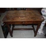 An antique cottage farm house side table in a provincial French design having chamfered and pegged