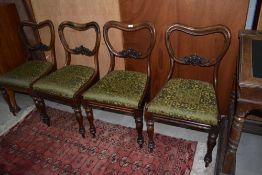 A set of four Victorian mahogany balloon back dining chairs , stain worn, nice quality chairs in