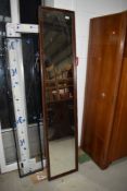 A vintage full length wall mirror