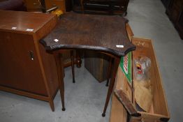 An early 20th Century oak occasional table having shaped top, width approx. W52cm