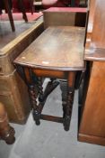 A drop leaf farm house or kitchen table traditional oak with twist legs
