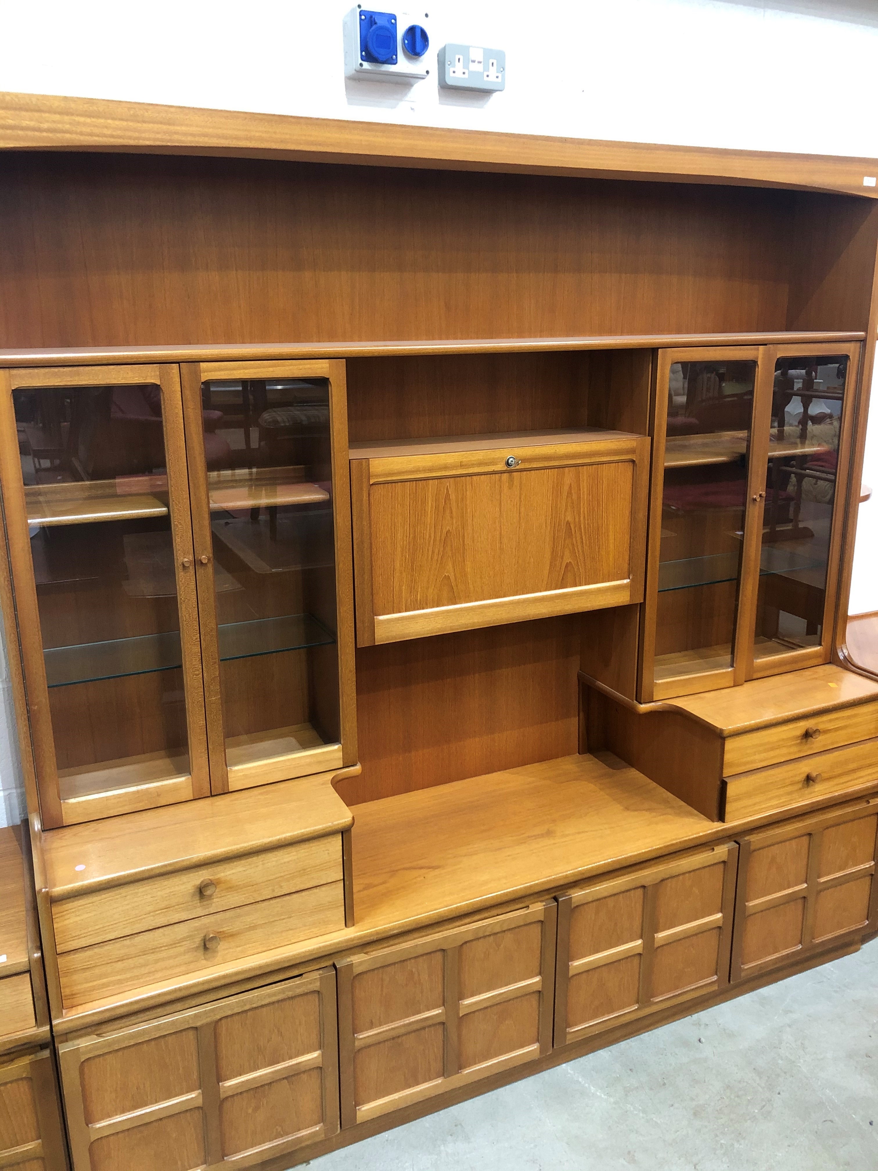 A mid century design wall unit by Nathan having glazed display shelving 190cm long