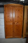 A modern pine wardrobe, no back, easily replaceable with plywood or hardboard, or fix to a wall,