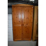 A modern pine wardrobe, no back, easily replaceable with plywood or hardboard, or fix to a wall,