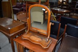 A Victorian satinwood toilet mirror having trinket base