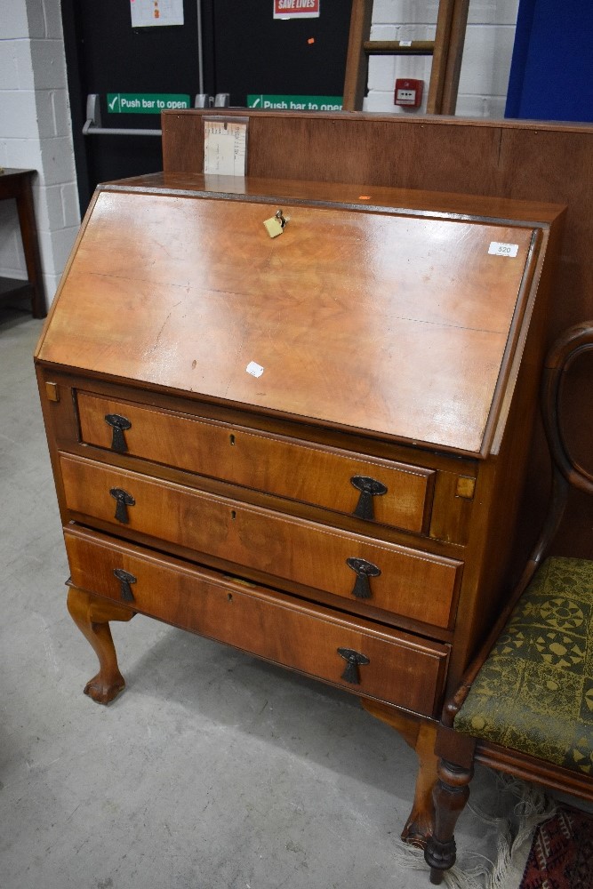 An early to mid 20th Century walnut bureau on ball and claw feet, width approx. 74cm