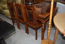 An modern hardwood 'sheesham' style dining table and 8 similar chairs, table approx. 170 x 92cm