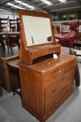 A late Victorian stained Ash chest of two over two drawers having mirrored dressing table back 100cm