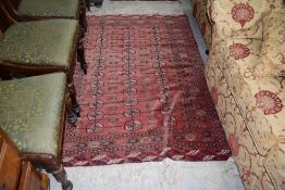 A traditional Persian rug in the Afghan style, red ground, approx. 160 x 118cm