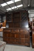 A priory style dresser, dark stained, width approx. 135cm