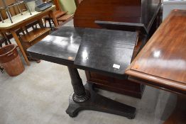 A Victorian ebonised side table, having offset tulip column, the cantilever top having integrated