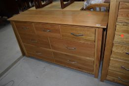 A modern golden oak sideboard/chest of three over two over two drawers, dimensions approx. W138cm