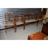 An Edwardian mahogany and inlaid salon suite, comprising settee and four (two plus two) chairs -