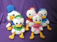 A set of five 1986 Hasbro Disney soft toys, Scrooge McDuck, Huey, Louie, Dewey and Webby, all with