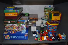 A shelf of modern Games and Toys including John Jaques Garden Quoits, Tomy Rumble inthe Jungle,