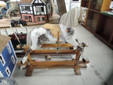A traditional Line Bros Rocking Horse, stamped 'LB Ltd SP2', hand painted dapple grey with