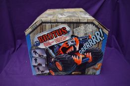 A 1990's Mattel Brutus The Bad Dog battery operated chain controlled 4x4 vehicle, in original box,