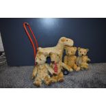 A mid 20th century Triang plush push along dog on metal frame along with five 1950's and later straw