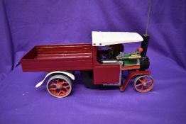 A Mamod Live Steam Wagon SW1 having traditional green and black engine with repainted burgundy body