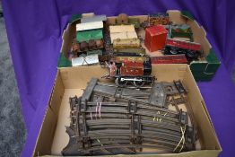 A selection of Hornby 0 gauge including 0-4-0 LMS engine, two carriages, rolling stock, buffer stops