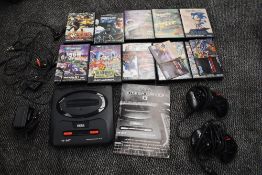 A Sega 16-Bit Mega Drive II Console with two controllers and 10 cartridges, Ultimate Soccer, Sonic