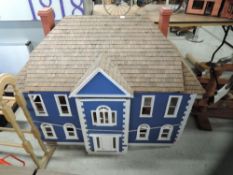 A Real Good Toys wooden hand built two storey Dolls House, unfurnished and part finished inside with